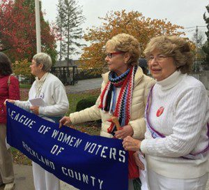 Photo of LWV of Rockland County women holding league banner celebrating sufragettes